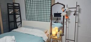 Postel nebo postele na pokoji v ubytování Bojeongdong 1room