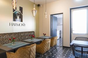 a dining room with tables and chairs and a sign that reads hammond at Petite Room With Wifi, Ac, And Shared Kitchen in Tilburg