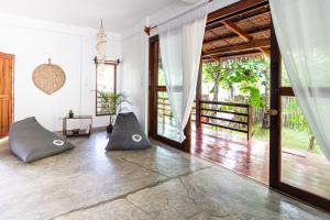a living room with two pillows on the floor at Good Balance Siargao in General Luna