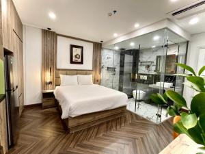 En eller flere senge i et værelse på G-Apartment & Hotel