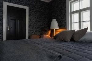 Ένα ή περισσότερα κρεβάτια σε δωμάτιο στο Finlandia Hotel Puu-Juuka