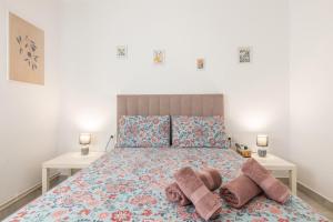 a bedroom with a large bed with two night stands at Mestral Port in Cambrils