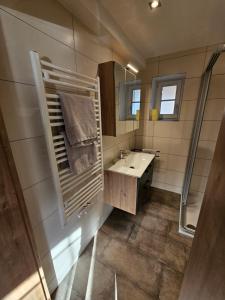 Koupelna v ubytování Günthers Apartments + 15 fotografií