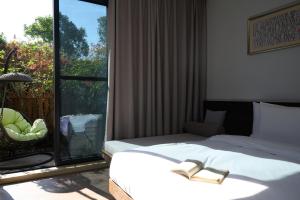 Voodi või voodid majutusasutuse Shanghai Zhujiajiao Xiangyu Independent Guesthouse toas
