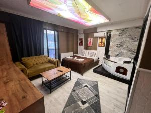 a living room with a couch and a table at Royal Suite Hotel in Istanbul