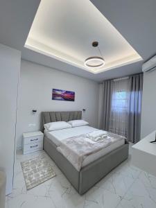 Ένα ή περισσότερα κρεβάτια σε δωμάτιο στο White and Cozy Apartment +6 φωτογραφίες