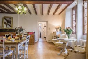 a living room with a table and a dining room at Chez sylvie et guy in Chignin