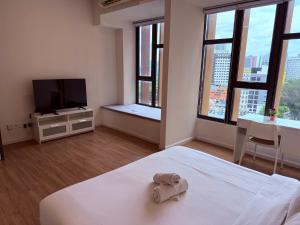 Postel nebo postele na pokoji v ubytování Ceylonz Suites by ROOMY