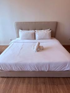 Postel nebo postele na pokoji v ubytování Ceylonz Suites by ROOMY