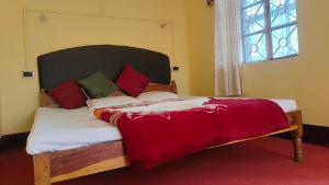 Postel nebo postele na pokoji v ubytování Hotel Kanchan View