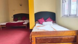 Voodi või voodid majutusasutuse Hotel Kanchan View toas