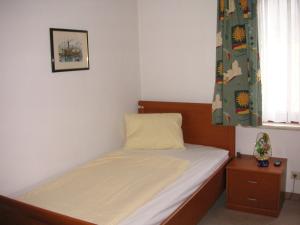 Una cama o camas en una habitación de HOTEL Jerolitsch