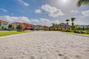 a basketball court in the middle of a street with houses at 8893 Candy Palm Road in Kissimmee