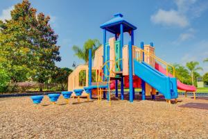 a playground with a slide in a park at 8893 Candy Palm Road in Kissimmee