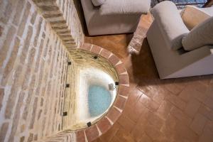 an overhead view of a swimming pool in a building at Casa Palacio De La Cruz in El Puerto de Santa María +179 photos