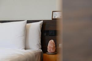 Voodi või voodid majutusasutuse Shanghai Zhujiajiao Xiangyu Independent Guesthouse toas