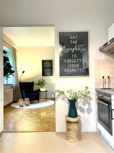 a living room with a couch and a table at APARTMENT KLAGENFURT Villa Frank No3 - with Free Parking, Smart-TV & Self Check-in in Klagenfurt