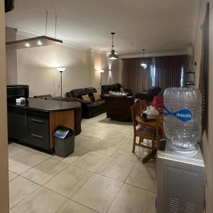 a living room with a couch and a table at Cozy 3BedRooms challet La Vista 5 - for Families only in Ain Sokhna +14 photos