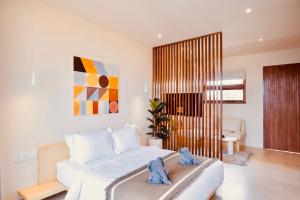 TheHub Pererenan Coworking, Pool and Rooftop客房内的一张或多张床位