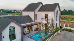 an aerial view of a house with a swimming pool at Arkas Oon Pool Villa Khaoyai in Ban Nong Chaeng