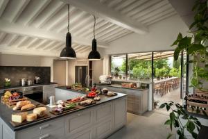 a kitchen with a counter with food on it at Il Casolese, Private Pool, Nature, Greve In Chianti in Greve in Chianti