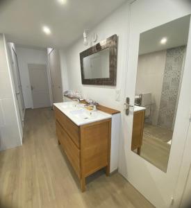 a bathroom with a sink and a mirror at La Marjalou à Vence avec piscine & grand jardin in Vence +30 photos