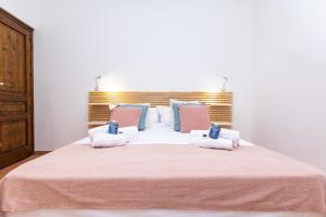 En eller flere senge i et værelse på Domus 116 Ortigia by Ortigiaapartments