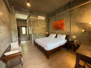 Postel nebo postele na pokoji v ubytování วิลลา วาดี แม่กำปอง Villa Vadee Maekampong