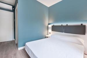 Elba Vibe Smart Hotel客房内的一张或多张床位