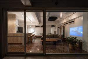 a living room with a couch and a tv at DESLIE - Vacation STAY 74346v in Sarahama