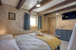 a bedroom with a large bed and a window at Casa Emilia in Sveti Donat in Buzet +42 photos