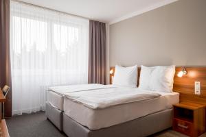 Postel nebo postele na pokoji v ubytování Hotel Vista
