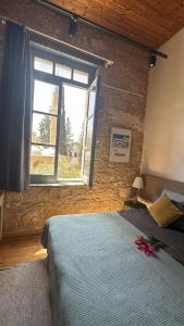 Postel nebo postele na pokoji v ubytování TasEV Guesthouse