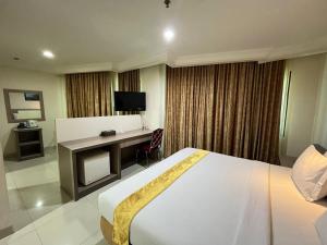 Postel nebo postele na pokoji v ubytování Manise Hotel