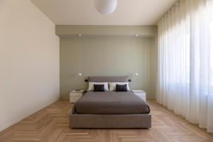 Ένα ή περισσότερα κρεβάτια σε δωμάτιο στο Lilium Luxury Apartment