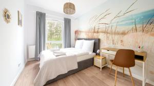 Posteľ alebo postele v izbe v ubytovaní Apartamenty Sun & Snow Let's Sea Baltic Park