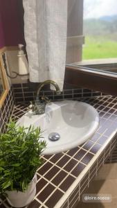 a white sink in a bathroom with a window at casa rural larre aundi in Rentería +54 photos