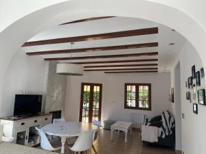 a living room with a white table and chairs at La Duna de Denia in Denia