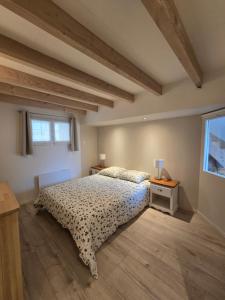Ένα ή περισσότερα κρεβάτια σε δωμάτιο στο Maisonnette Cosy