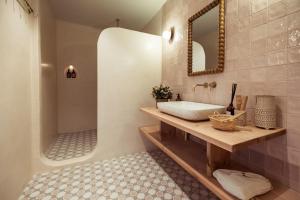 a bathroom with a sink and a bath tub at Nomad Hotel & Spa Altea in Altea +74 photos