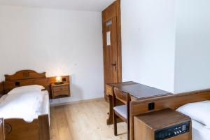 Postel nebo postele na pokoji v ubytování Hotel Chesa Grischa