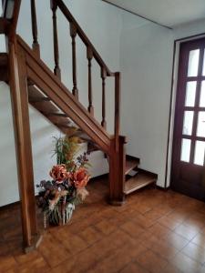 a staircase with a bunch of flowers on the floor at Casa Gelsomino tra Natura&Comfort in Vistrorio