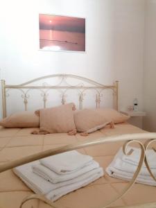 Un pat sau paturi într-o cameră la Kosamè - BNB Holiday House in vero stile pugliese
