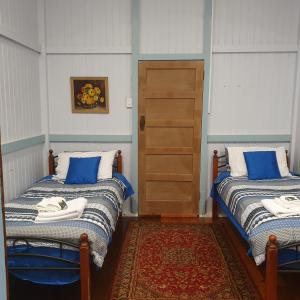 Ένα ή περισσότερα κρεβάτια σε δωμάτιο στο The Falls Teahouse