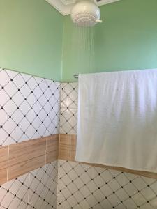Koupelna v ubytování RUSINGA SUITES