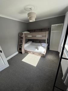 a small room with a bunk bed in it at 3 bedroom house, Caol, Fort William in Caol