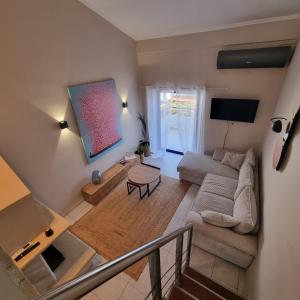 an overhead view of a living room with a couch at Vaios Luxury Apartments Polichrono in Polykhrono