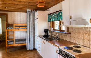 a kitchen with a sink and a counter top at 1 Bedroom Stunning Home In Gamleby in Gamleby