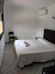 Postel nebo postele na pokoji v ubytování Hotel l'Albera