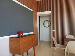 a dining room with a table and a mirror at B&B il Palazzo Cirella in Cirella +113 photos